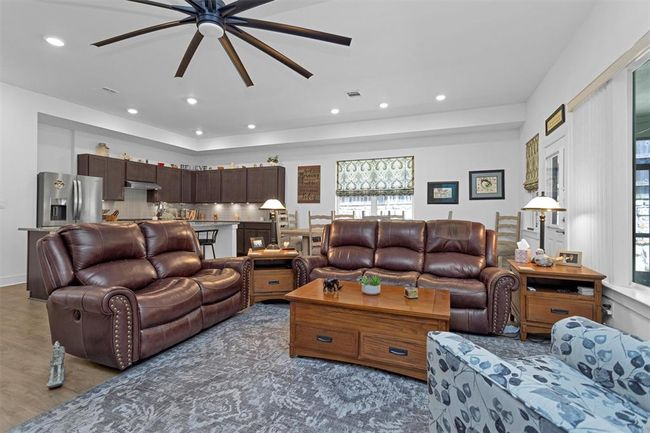 Bright and open living space with large windows that fill the room with natural light. The layout offers a perfect blend of comfort and style—ideal for everyday living and entertaining guests. | Image 17