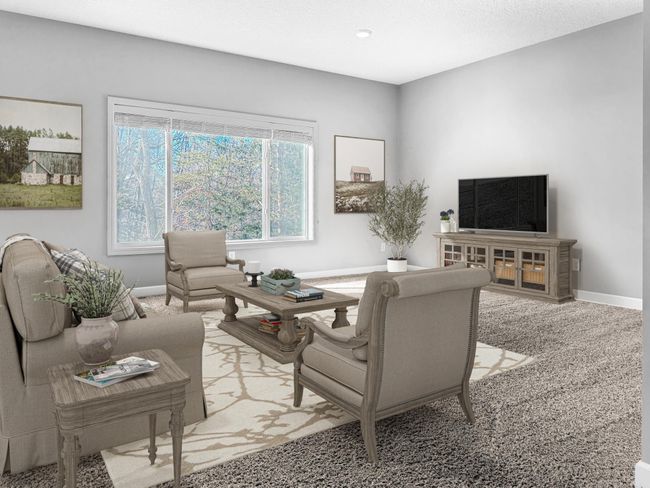Open concept living room features fresh paint and overlooks wooded back yard. | Image 7