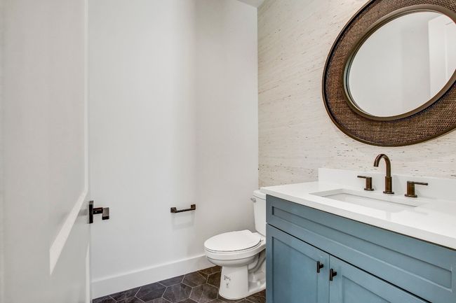 Bathroom featuring vanity, tile patterned flooring, toilet, and baseboards | Image 9