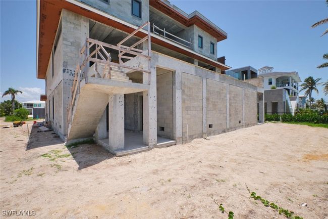 Back of property featuring concrete block siding | Image 8