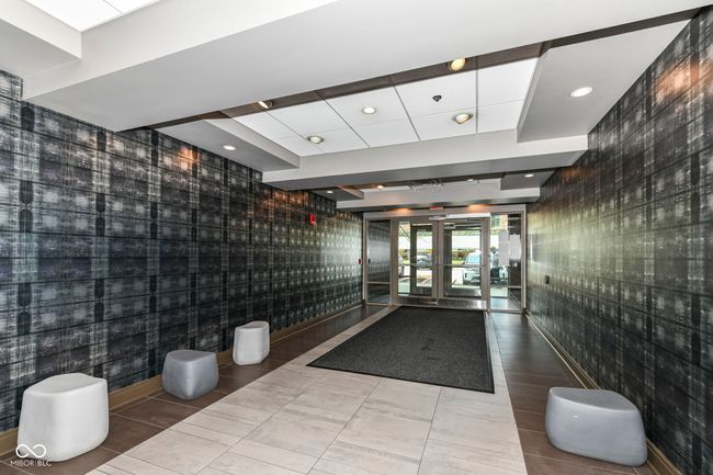 Tastefully decorated foyer greets your guests once you have buzzed them into the building. | Image 4