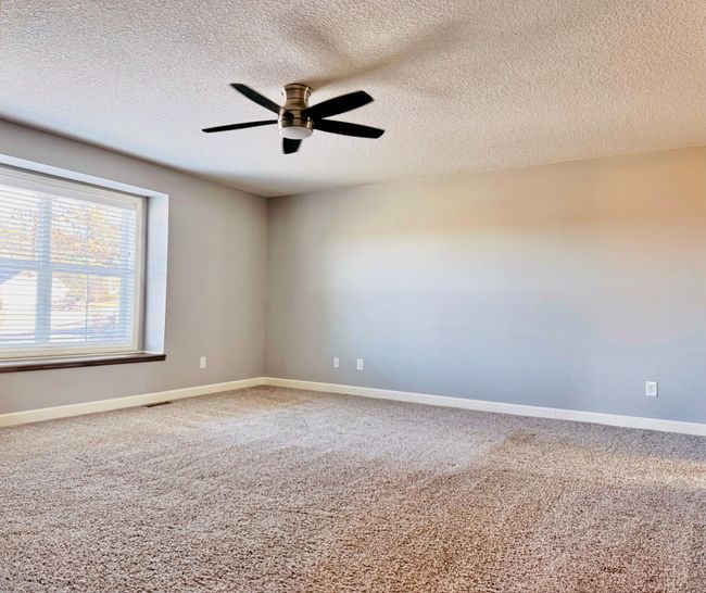Owner's Bedroom features fresh paint, ceiling fan, and a window bench overlooking the Minnesota River Valley! | Image 8