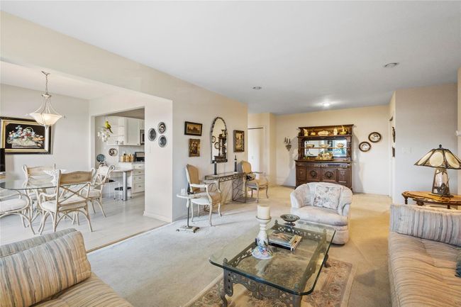 Living room featuring light colored carpet | Image 17