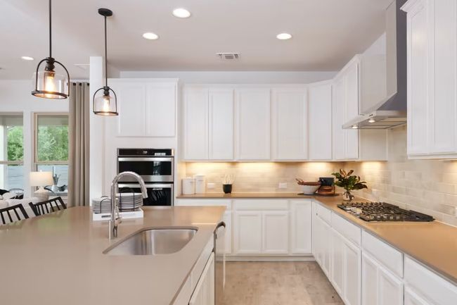 Photo of Pulte model home with same floor plan, not of actual home listed. | Image 12