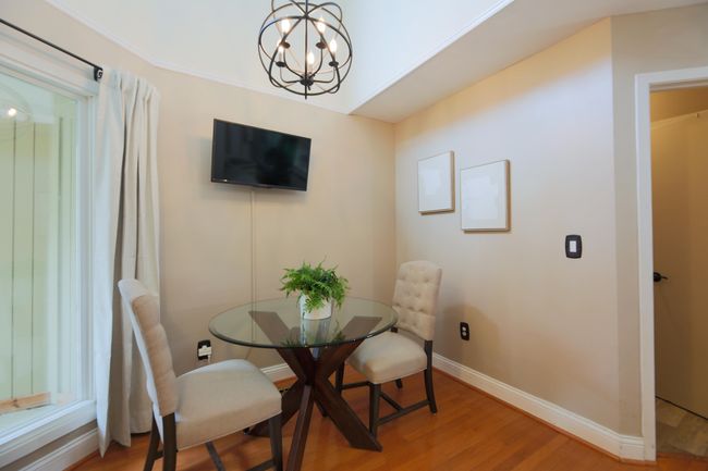 Breakfast Nook/Dining area with high ceilings and newer lighting. | Image 6