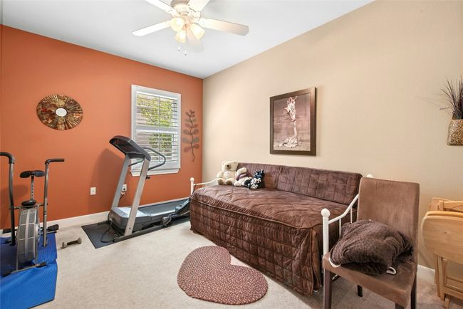 Workout room featuring carpet flooring and ceiling fan | Image 13