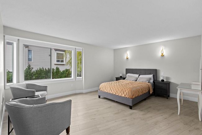 Bedroom featuring light wood finished floors and baseboards | Image 21