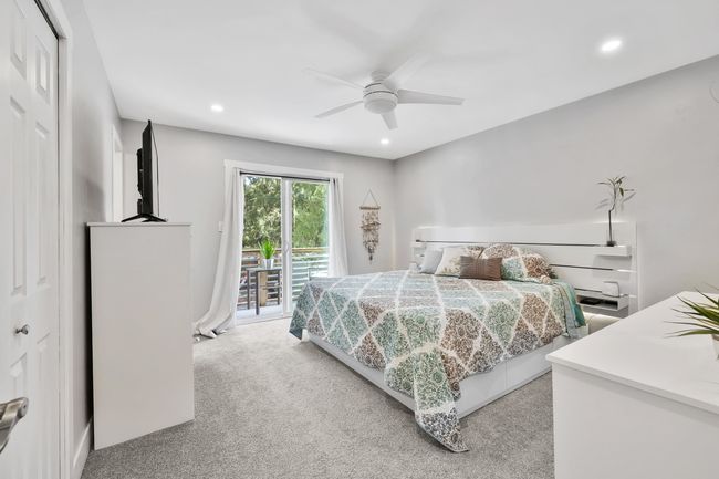 Bedroom featuring light carpet, recessed lighting, access to exterior, and a ceiling fan | Image 23