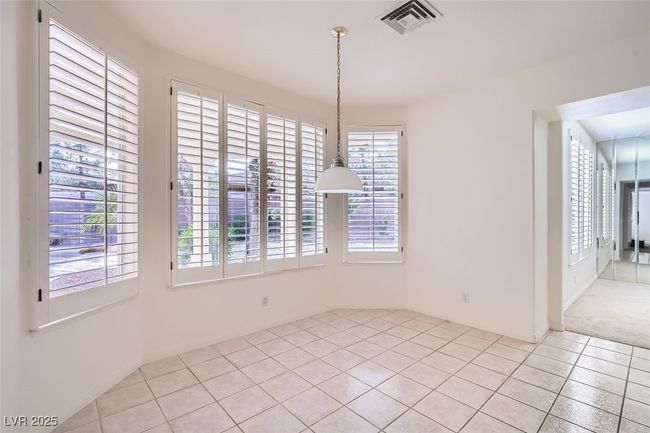 Unfurnished dining area featuring light tile patterned flooring and visible vents | Image 30