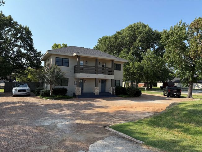 View of front facade featuring a balcony and driveway | Image 4