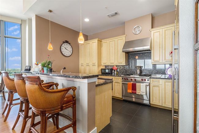 KITCHEN OPEN TO LIVING AND DINING | Image 8