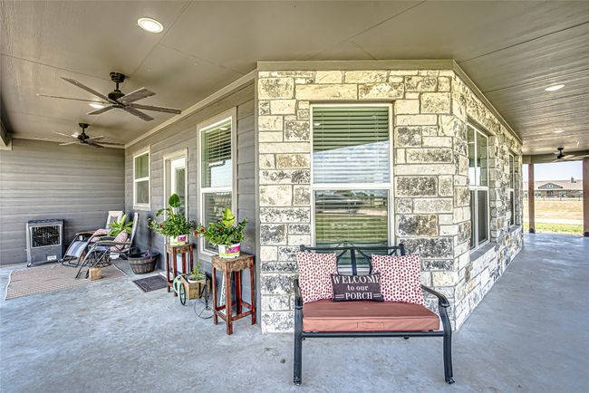 View of patio with ceiling fan | Image 29