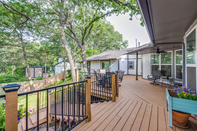 Deck featuring outdoor dining area and fence | Image 23