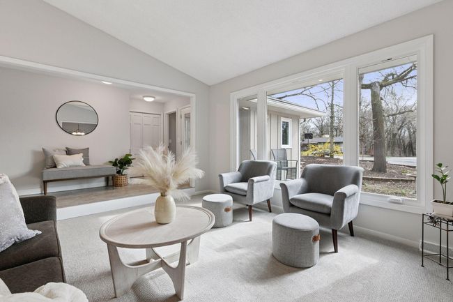 Vaulted ceilings and large windows bring in natural light | Image 8