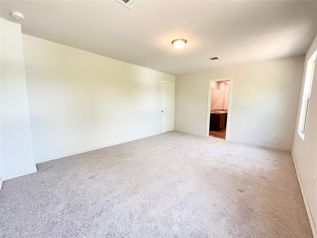 Spacious upstairs master bedroom with cozy carpeting. | Image 15