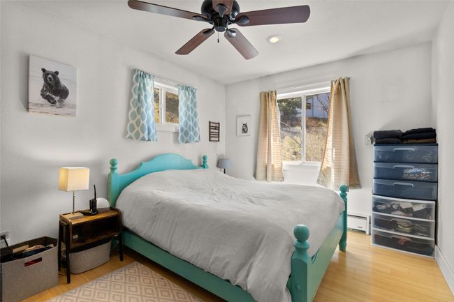 Bedroom featuring wood finished floors, recessed lighting, and ceiling fan | Image 38