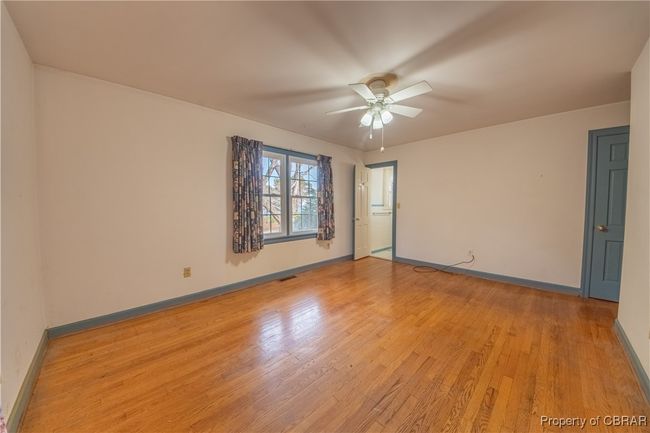 Empty room featuring ceiling fan and light hardwood / wood-style floors | Image 18