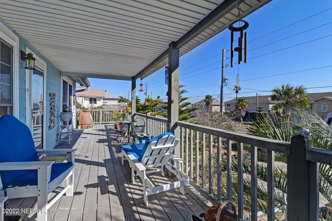 Unit A's large covered porch with views of the ocean. | Image 15