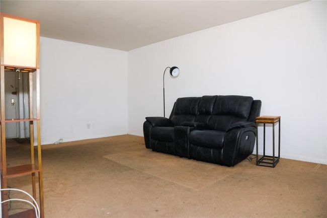 Living area featuring carpet and baseboards | Image 8