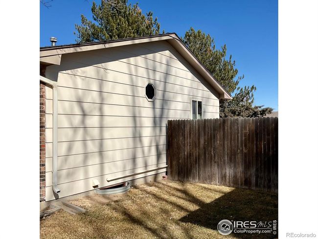 South Side of Home with Wood Privacy Fencing | Image 24