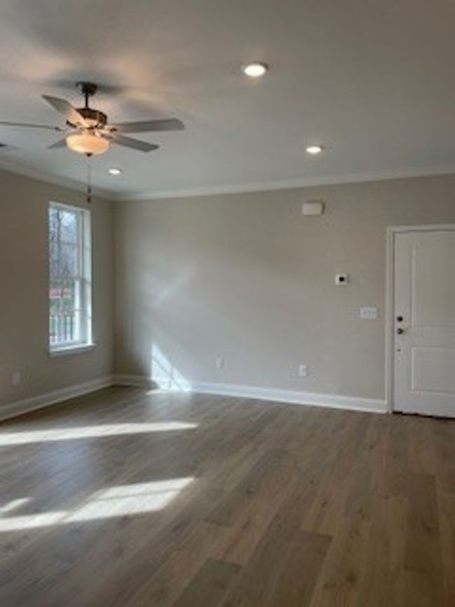 Living room with lots of natural lighting. Laminate flooring. Lots of recessed lights. Ceiling Fan. | Image 8