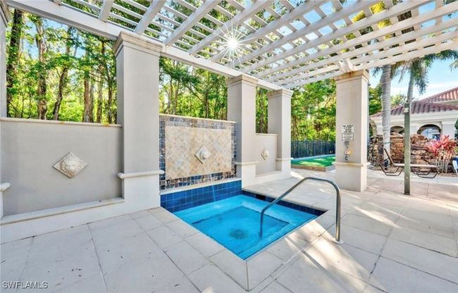 View of pool with a pergola, fence, and a patio | Image 26