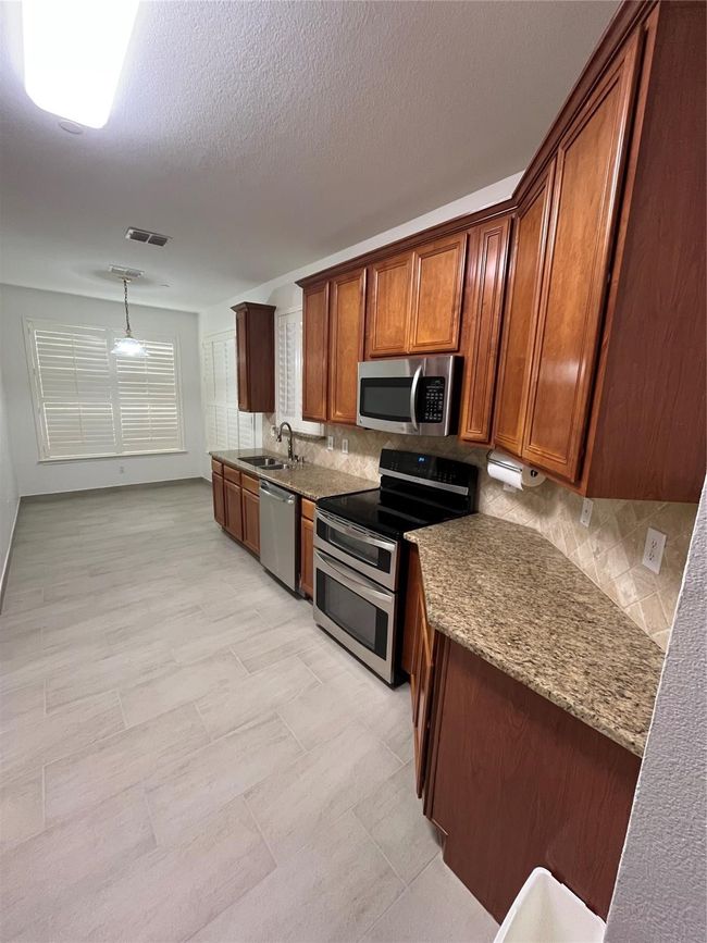 8605 Hunters Trace Ln, Townhouse with 3 bedrooms, 3 bathrooms and null parking in Plano TX | Image 9