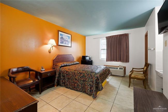 Bedroom featuring light tile patterned floors | Image 9