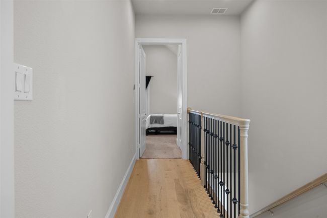 Hall with an upstairs landing and light wood-style floors | Image 15
