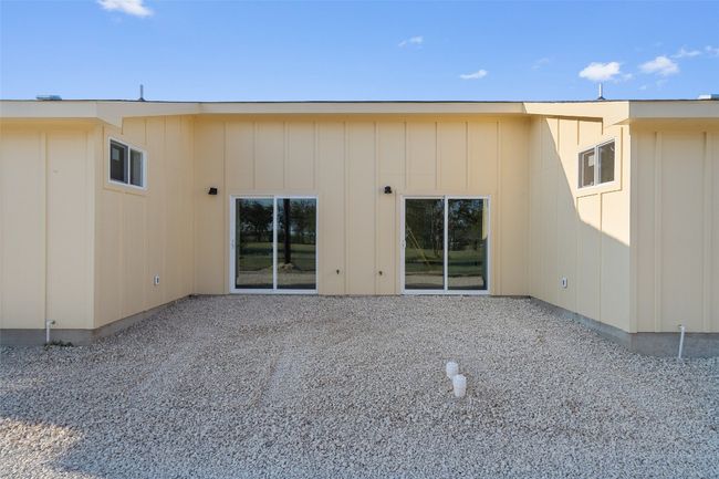 Rear view of house with board and batten siding | Image 13