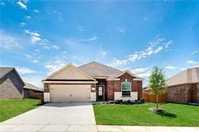 Ranch-style home with a garage and a front lawn - picture when they purchased 2018 | Image 1