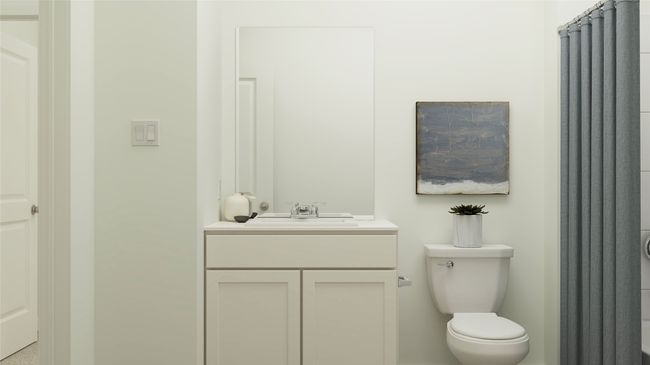 Bathroom featuring vanity and toilet | Image 10