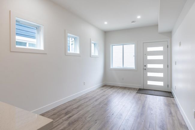 Entrance foyer featuring wood finished floors, baseboards, and recessed lighting | Image 4
