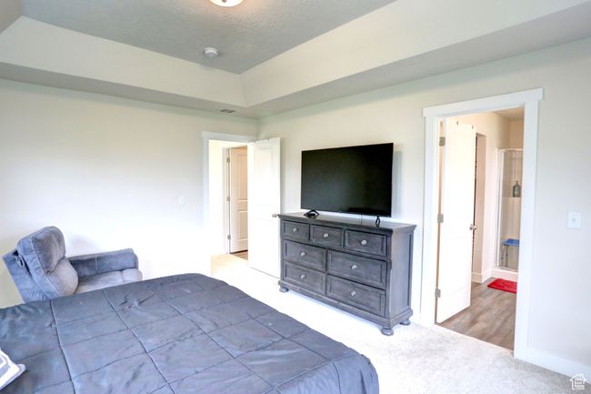 Carpeted bedroom with baseboards and visible vents | Image 13