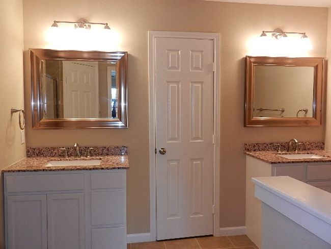 Full bathroom with two vanities and tile patterned flooring | Image 13