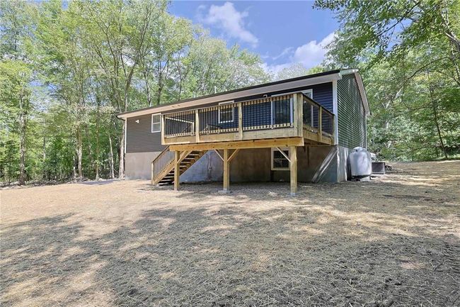 View of front of property featuring a wooden deck | Image 27