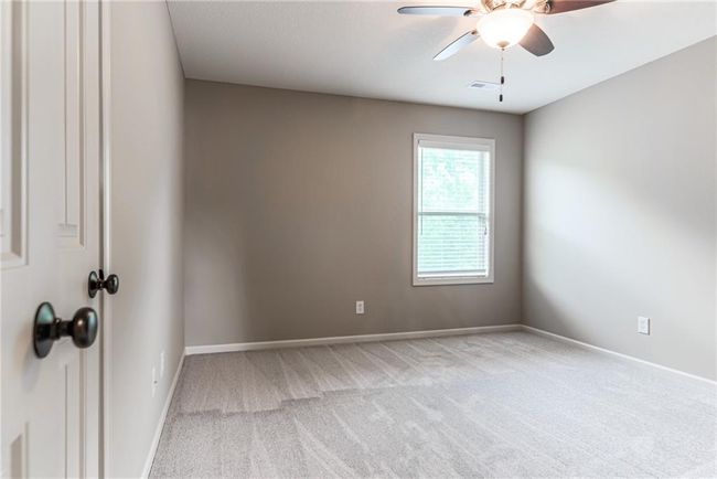 Carpeted spare room with ceiling fan and baseboards | Image 35