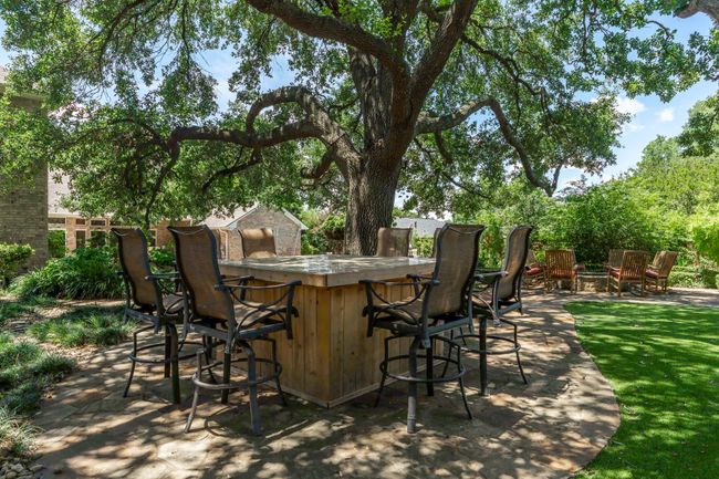 One of four outdoor sitting areas in backyard | Image 36