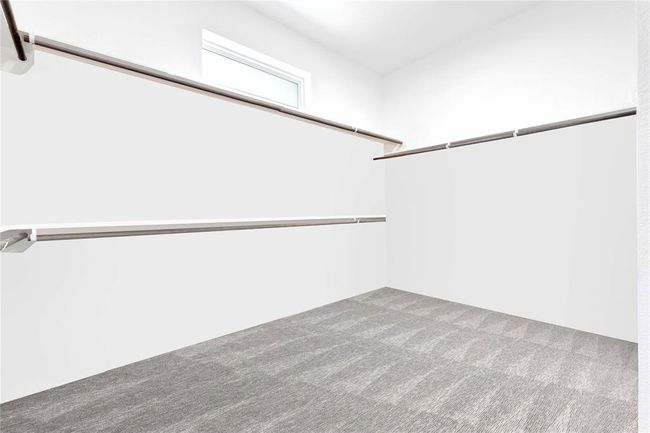 Section of primary bedroom Oversized walk in closet ready for any customization | Image 31