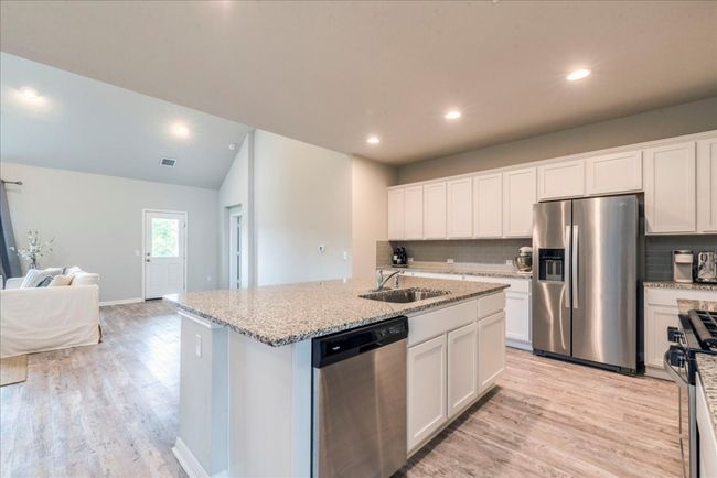 Spacious kitchen with plenty of cabinet and counter space | Image 7