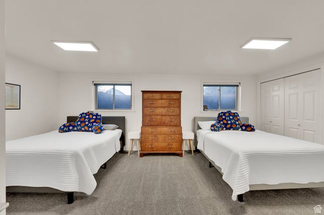 Bedroom featuring carpet flooring and a closet | Image 30