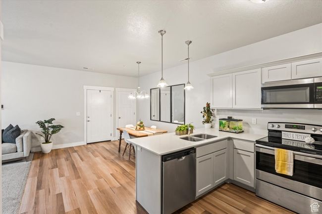 Kitchen and dining room with gorgeous flooring | Image 9