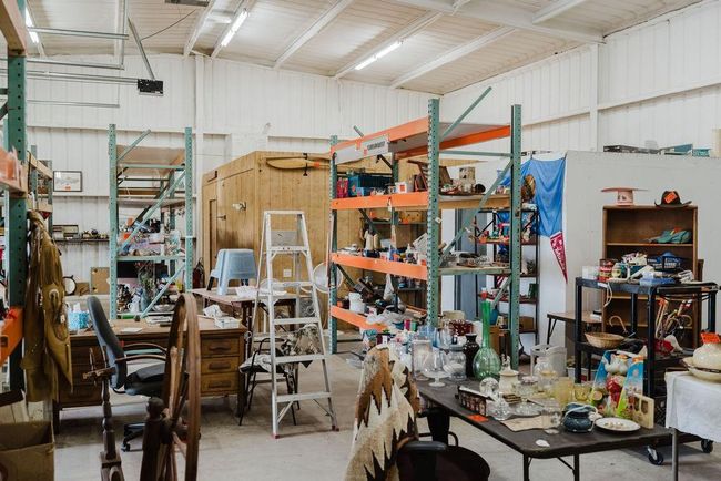 Garage with a workshop area and metal wall | Image 21