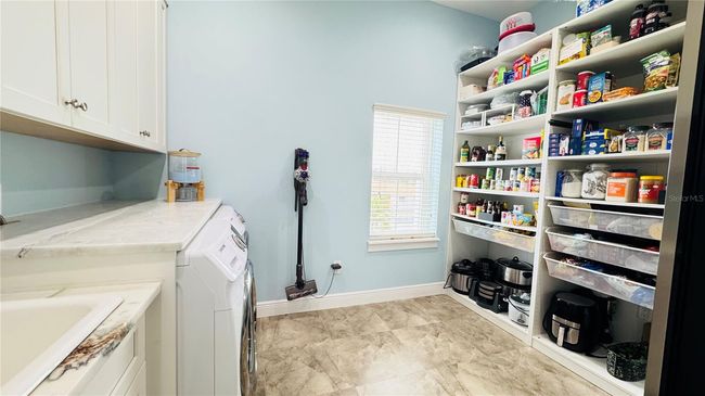 Large pantry/laundry room. | Image 39