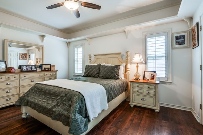 Middle Bedroom with display shelf around the whole room and walk in closet | Image 24