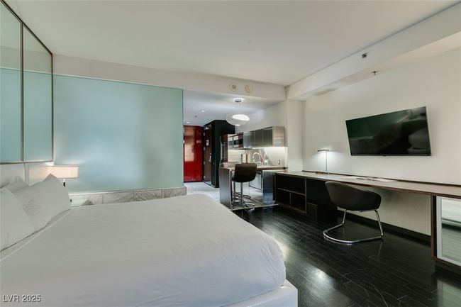 Bedroom with dark wood finished floors and a sink | Image 20