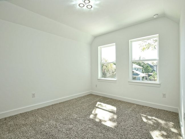 Bonus room with lofted ceiling and carpet | Image 23