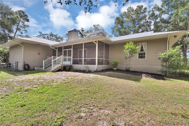 Screened back porch, fenced area for pets | Image 39