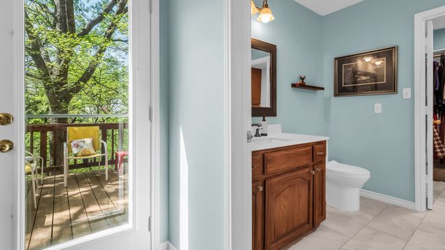 Bathroom with toilet, tile patterned floors, a wealth of natural light, and vanity | Image 18