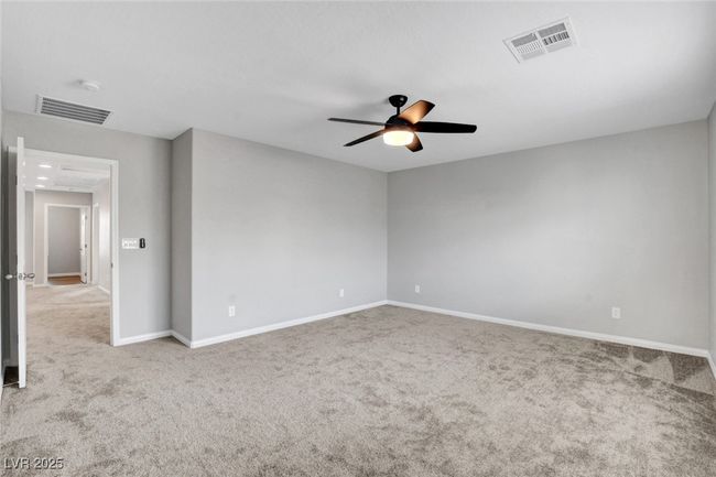 Unfurnished room with carpet floors, a ceiling fan, and baseboards | Image 40